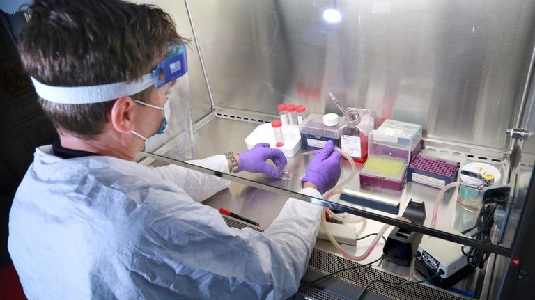 A lab worker at Codagenix demonstrates biotech innovations at the...