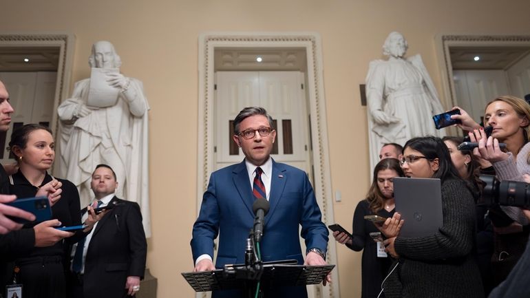 Speaker of the House Mike Johnson, R-La., talks briefly to...