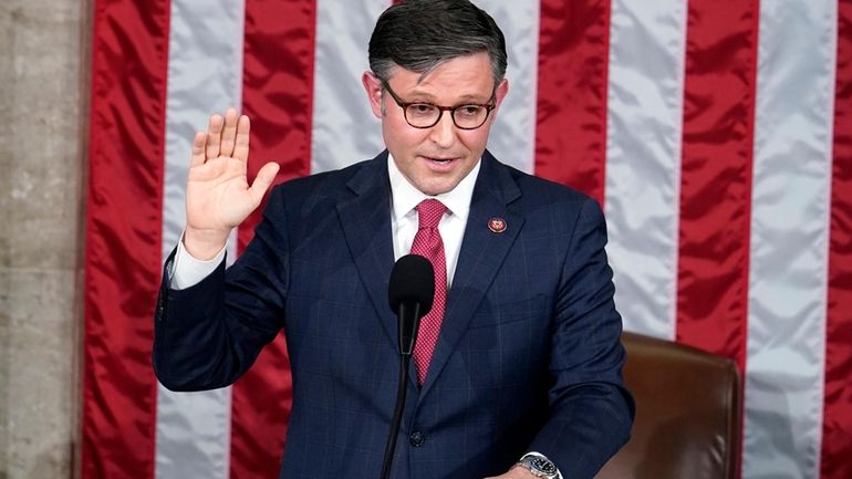 Rep. Mike Johnson, R-La., takes the oath to be the...