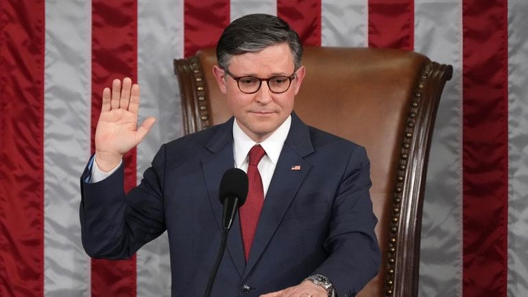 House Speaker Mike Johnson, R-La., takes the oath of office...