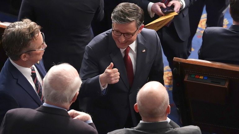 House Speaker Mike Johnson, R-La., gives a thumbs-up as the...