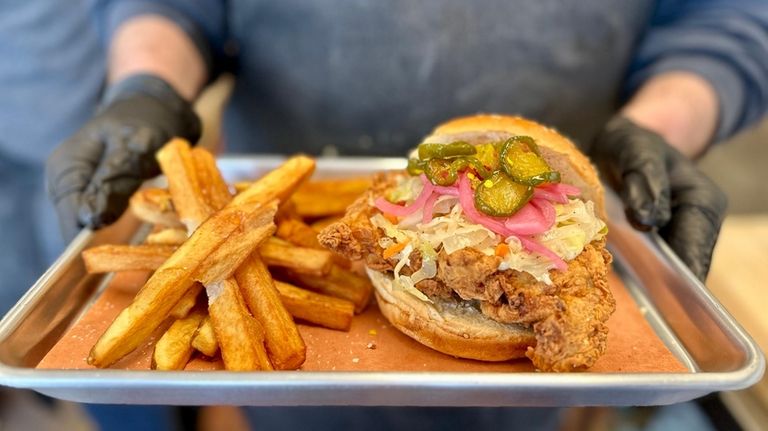 The fried chicken sandwich with candied jalapenos, pickled onion, vinegar...