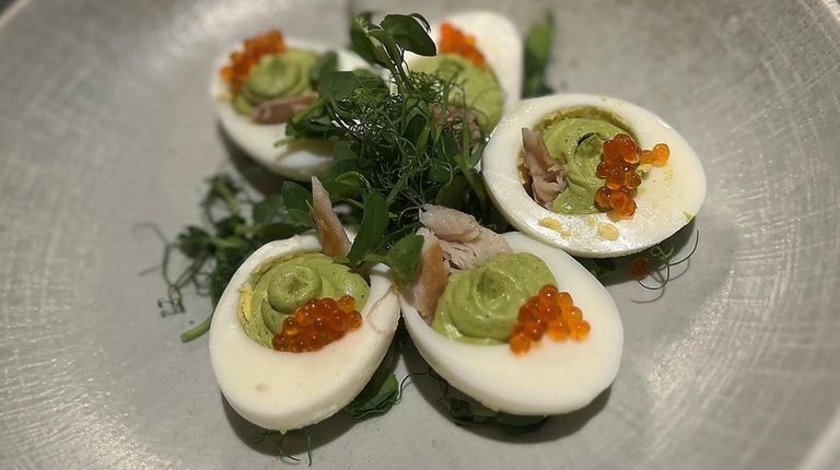 Deviled eggs stuffed with smoked trout and roe at James...