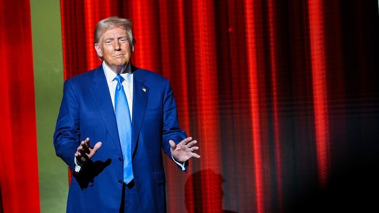 President-elect Donald Trump takes the stage before speaking at the...