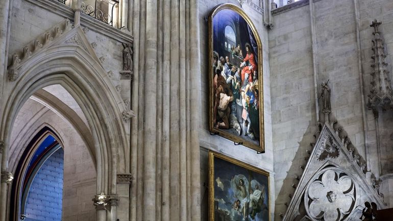 Paintings are seen inside Notre-Dame de Paris cathedral while French...