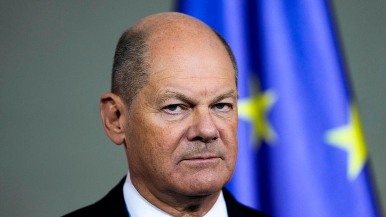 German Chancellor Olaf Scholz gives a statement at the chancellery...