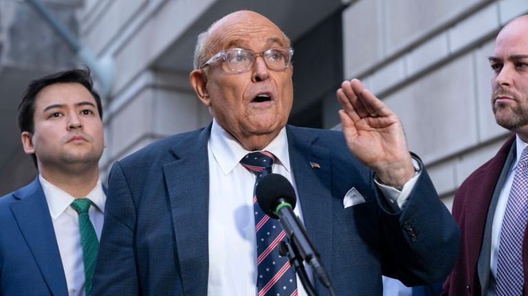 Rudy Giuliani speaks after leaving federal court in Washington, Friday,...