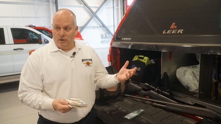 Long Island MacArthur Airport Fire Chief Al Cinotti displays tools...