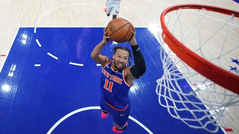 The Knicks' Jalen Brunson goes up for a dunk during...