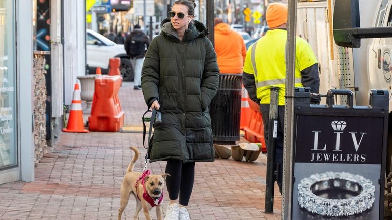 Emily Marino, of Smithtown, walks down New York Avenue in...