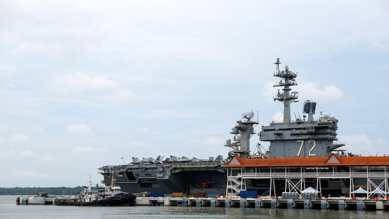 The Nimitz-class aircraft carrier USS Abraham Lincoln is docked during...