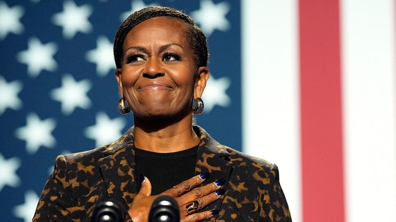 Former first lady Michelle Obama speaks at a campaign rally...