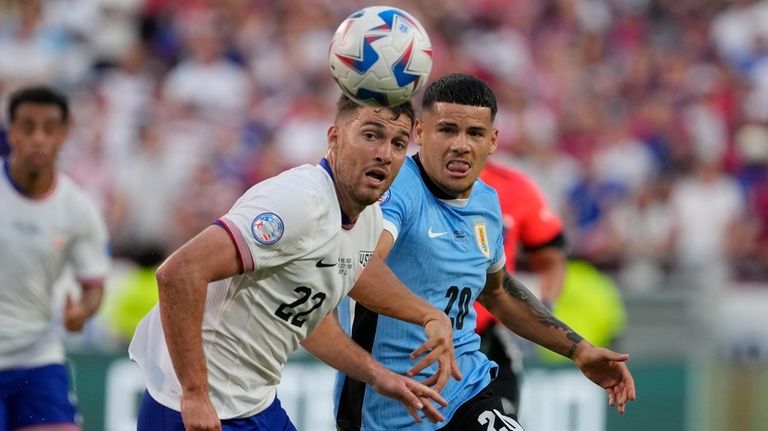 Joe Scally, left, of the United States, and Uruguay's Maximiliano...