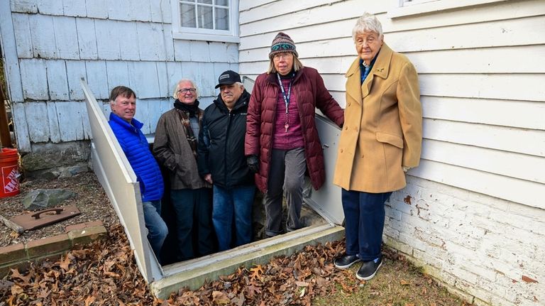 Flooding from the August storm inundated the site's basement. Standing at the...