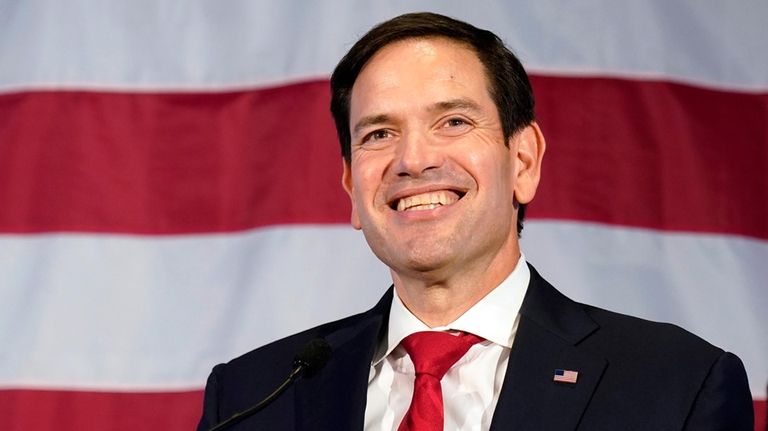 Sen. Marco Rubio, R-Fla., smiles as he addresses supporters Nov....