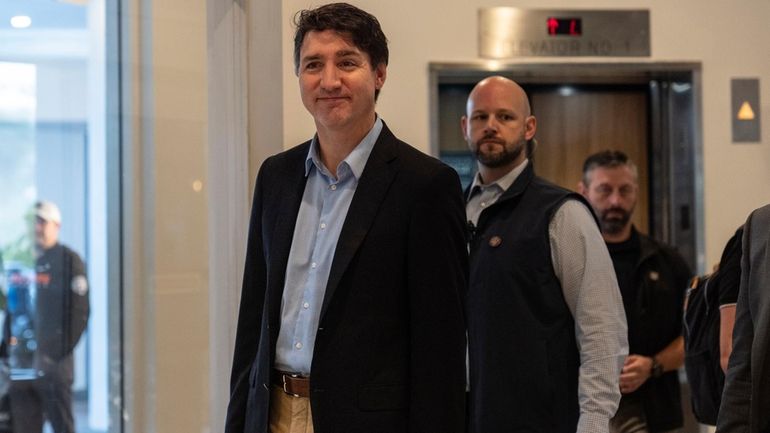 Canada Prime Minister Justin Trudeau walks through the lobby of...