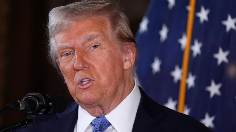 President-elect Donald Trump speaks during a news conference at Mar-a-Lago...